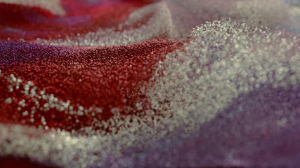 Colored Glitter particles with defocused blur background
