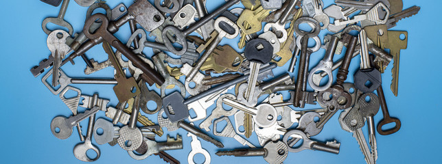 Keys set on blue background. Door lock keys and safes for property security and house protection....
