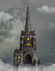 Gothic church bell tower surrounded by clouds