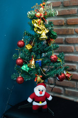 Santa Cluas Christmas composition on the brick wall background  Beautiful decoration and elegant accessories. Merry Christmas and Happy Holidays