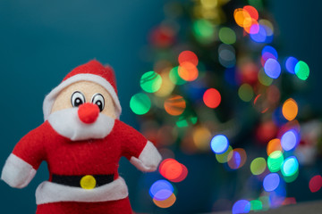 Santa Cluas  composition on the green wall background  Beautiful decoration and elegant accessories. Merry Christmas and Happy Holidays, lighting on Christmas tree 