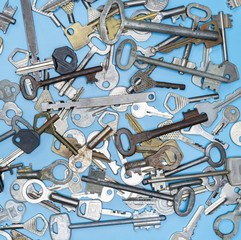 Keys set on blue background. Door lock keys and safes for property security and house protection....