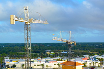 Fototapeta na wymiar Tower cranes at construction site