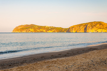 Morning sand beach on Tyrrhenian sea coast with mountains on background in Cilento Vallo di Diano and Alburni National park in province of Salerno, Italy