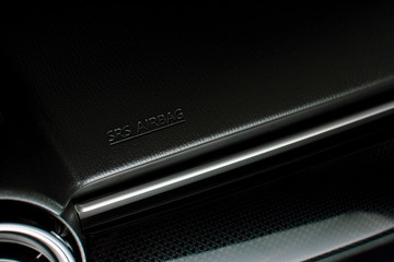 SRS Airbag icon on a car console panel in sport luxury car.