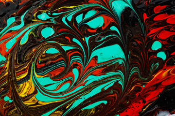 Macro close up of different color oil paint. Mixed liquid paints. Abstract background.