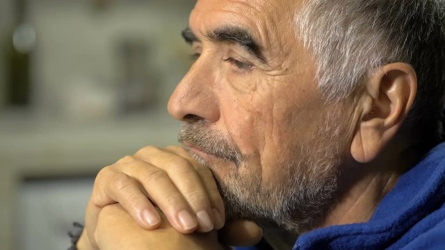 Sad thoughtful mature widower thinking about his dead wife.Depression, solitude
