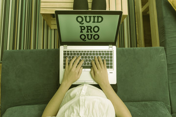 Writing note showing Quid Pro Quo. Business concept for A favor or advantage granted or expected in...