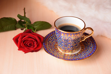 cup of coffee and rose