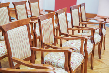 Many empty armchairs. Elite seats, comfortable armchairs, Conference room with brown many armchairs