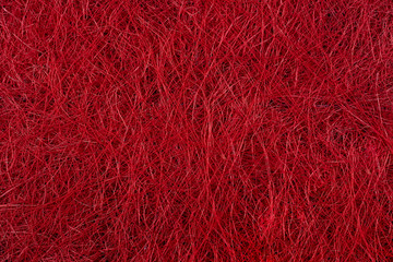 red background formed by very fine thread. texture