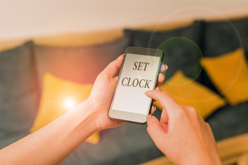 Word writing text Set Clock. Business photo showcasing put it to the right time or change the clock time to a later time woman using smartphone office supplies technological devices inside home