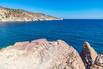 Waves, cliffs, rocks and sand in  Firopotamos beach