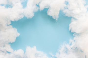 Soft clean cotton on light blue background.Frame clouds and copy space