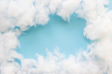 Frame a cotton wool clouds on light blue background. Concept clouds on sky blue.