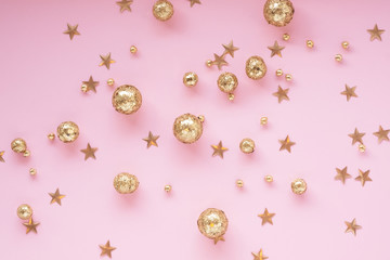 pink background with gold decorative balls and stars. Template banner for greeting card your text design 2020. New year, christmas, birthday