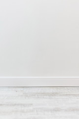 Empty room with white cement wall texture and white wooden floor pattern. 