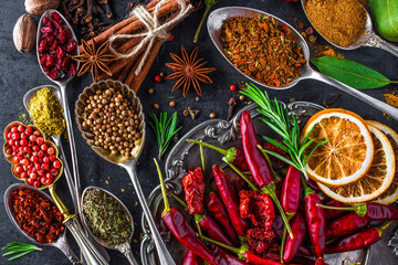 Spices and herbs in metal bowls. Food and cuisine ingredients. Colorful natural additives.