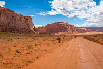 Fototapeta na wymiar Road and red rocks in Monument Valley. Navajo Tribal Park landscape, Utah/Arizona, USA