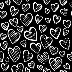 Romantic seamless pattern with cute images of hearts on a black background. Chalk drawing on a school blackboard.