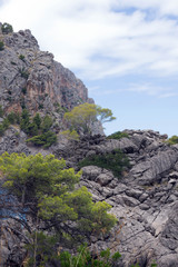 Fototapeta na wymiar Beautiful famous bay of Sa Calobra on the island of Mallorca, Spain. Turquoise sea, rocks. Travel to the Balearic Islands.