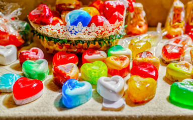 Handmade Soap Souvenirs at stalls during Christmas market in Riga, Latvia. Wooden balls in jar as decoration in home. Street Xmas holiday fair. Advent and Stalls with Crafts Items on Bazaar