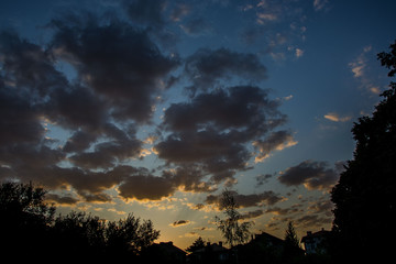 Beautiful blue hour, the sunset sky with colorful clouds, low light photography, cloudscape in the city