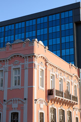 Old house and new building