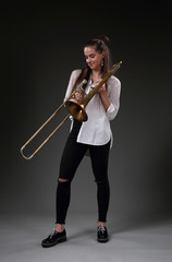 Cute girl with trombone