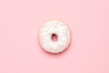 Sweet strawberry donut on pink background isolated flat lay