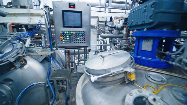 Equipment at dairy plant. Modern complex industrial equipment for milk production