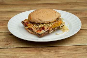Hamburger with meat, tomato, lettuce.