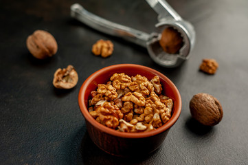 Walnuts. Kernels and whole nuts on a stone background