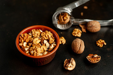 Walnuts. Kernels and whole nuts on a stone background