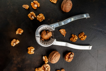 Walnuts. Kernels and whole nuts on a stone background