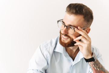 Cheerful young businessman isolated posing