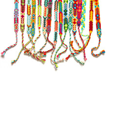 handmade friendship bracelets on white background, ethno boho style