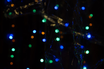 Fototapeta na wymiar Blur bokeh abstract background window night light street outside new year
