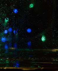 Blur rain drop window street evening night light bokeh abstract background