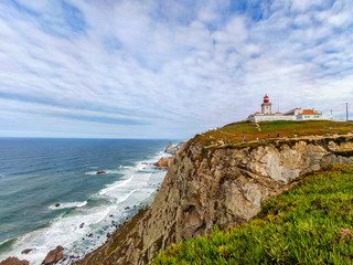 Fototapeta na wymiar The old lighthouse of cabo de Roca over the cliff
