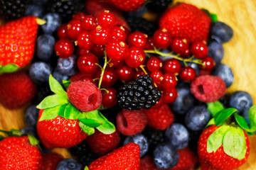 fresh and ripe assorted berries in close up