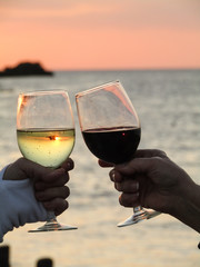 red and white wine at sunset