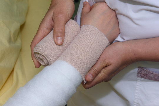 Lymphedema management: Wrapping Lymphedema Hand and Arm using multilayer bandages to control Lymphedema. Part of complete decongestive therapy (cdt) and manual lymphatic drainage (MLD)