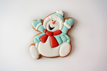 Gingerbread cookie snowman sugar glazed on white background