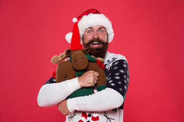 Love giver more than gift. Bearded man hug toy with love. Happy hipster celebrate new year and xmas. I love Christmas. Christmas is about love