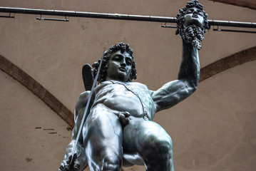 Florence, Italy - Perseus defeats Medusa sculpture, made by Benvenuto Cellini and located in Loggia dei Lanzi, in Piazza della Signoria