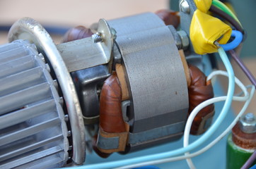 An electric motor combined with a rotor impeller, close view. Fan rotor inside the heater of Soviet...