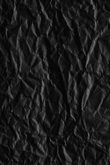 Dark black paper background creased crumpled blank posters old torn ripped surface grunge textures placard backdrop empty space for text     