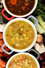 Set of soups from worldwide cuisines, healthy food. Broth with noodles, beef soup and broth with marrow dumplings. All soups with healthy vegetables on table