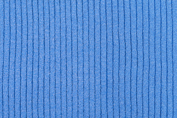 Blue knitted shiny striped and crumpled fabric, abstract background.